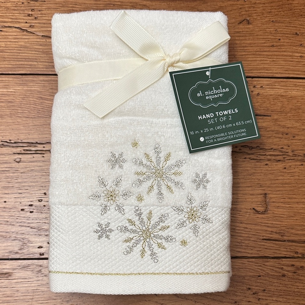 St. Nicholas Square Cream Towels with Silver and Gold Snowflakes